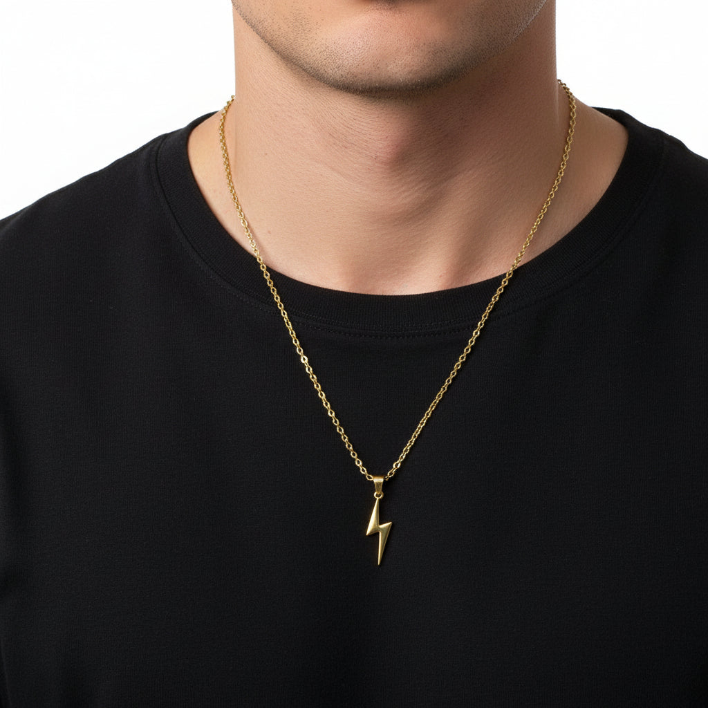 Gold lightning bolt pendant on a chain against