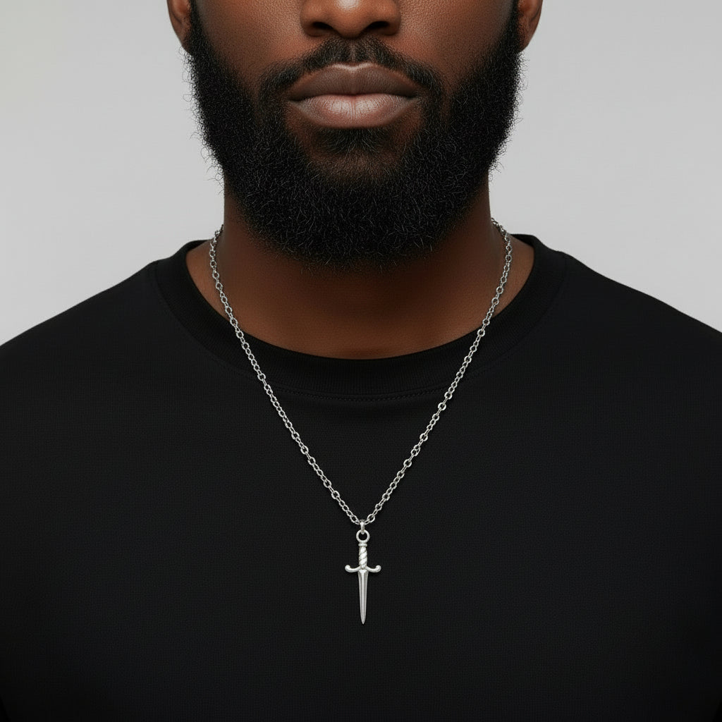 Silver sword-shaped pendant on a chain