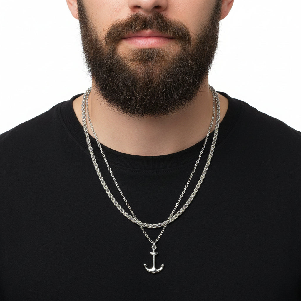 Silver anchor necklace on a white background