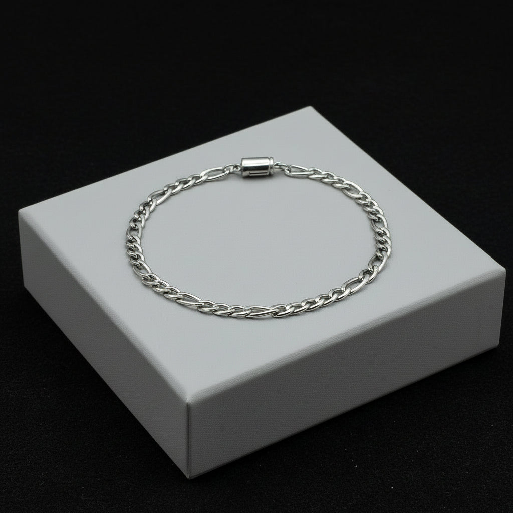 Silver figaro men's bracelet with a clasp on a white background