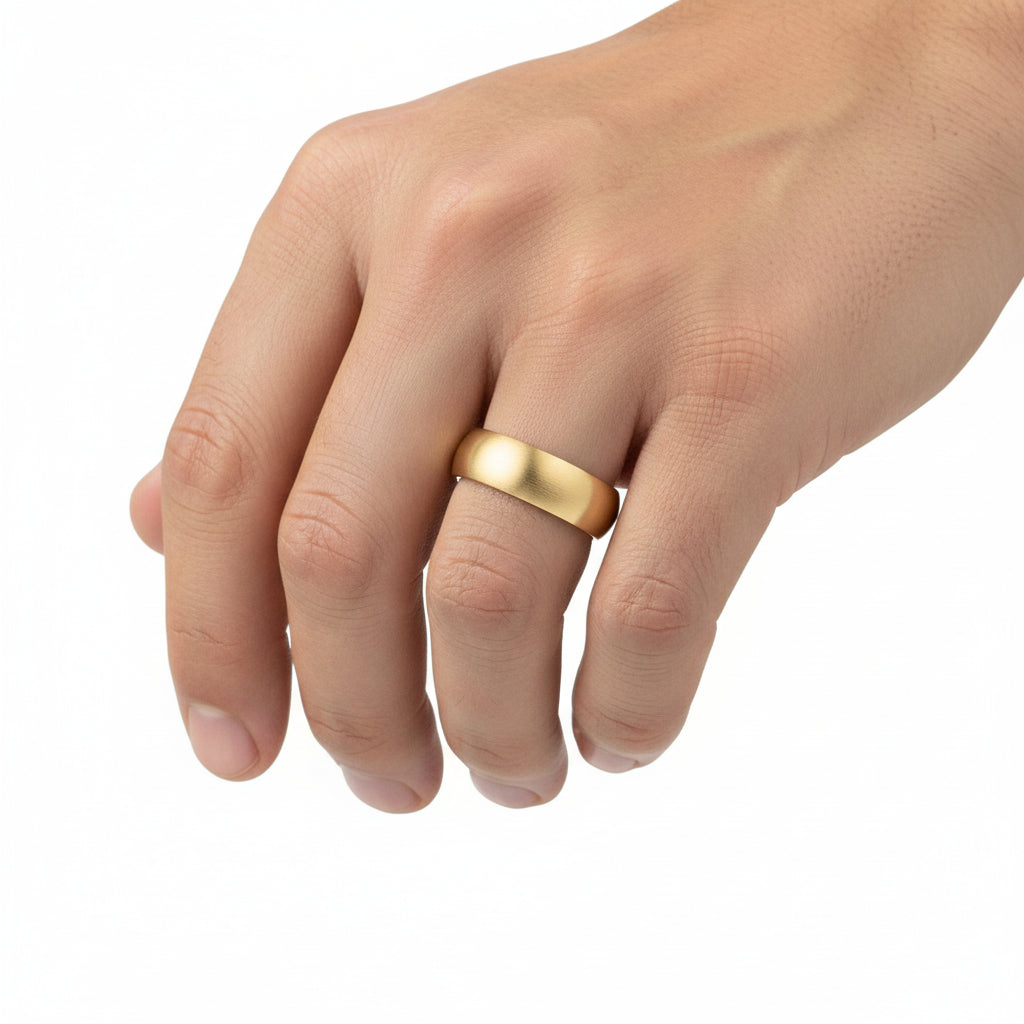 Gold ring with 'Arthur Alan' engraving on a white background